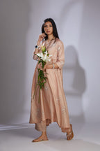 Peach silk hand-crushed asymmetric hem kurta set with block prints embellished with sequins