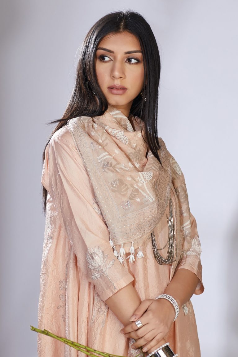 Peach silk hand-crushed asymmetric hem kurta set with block prints embellished with sequins