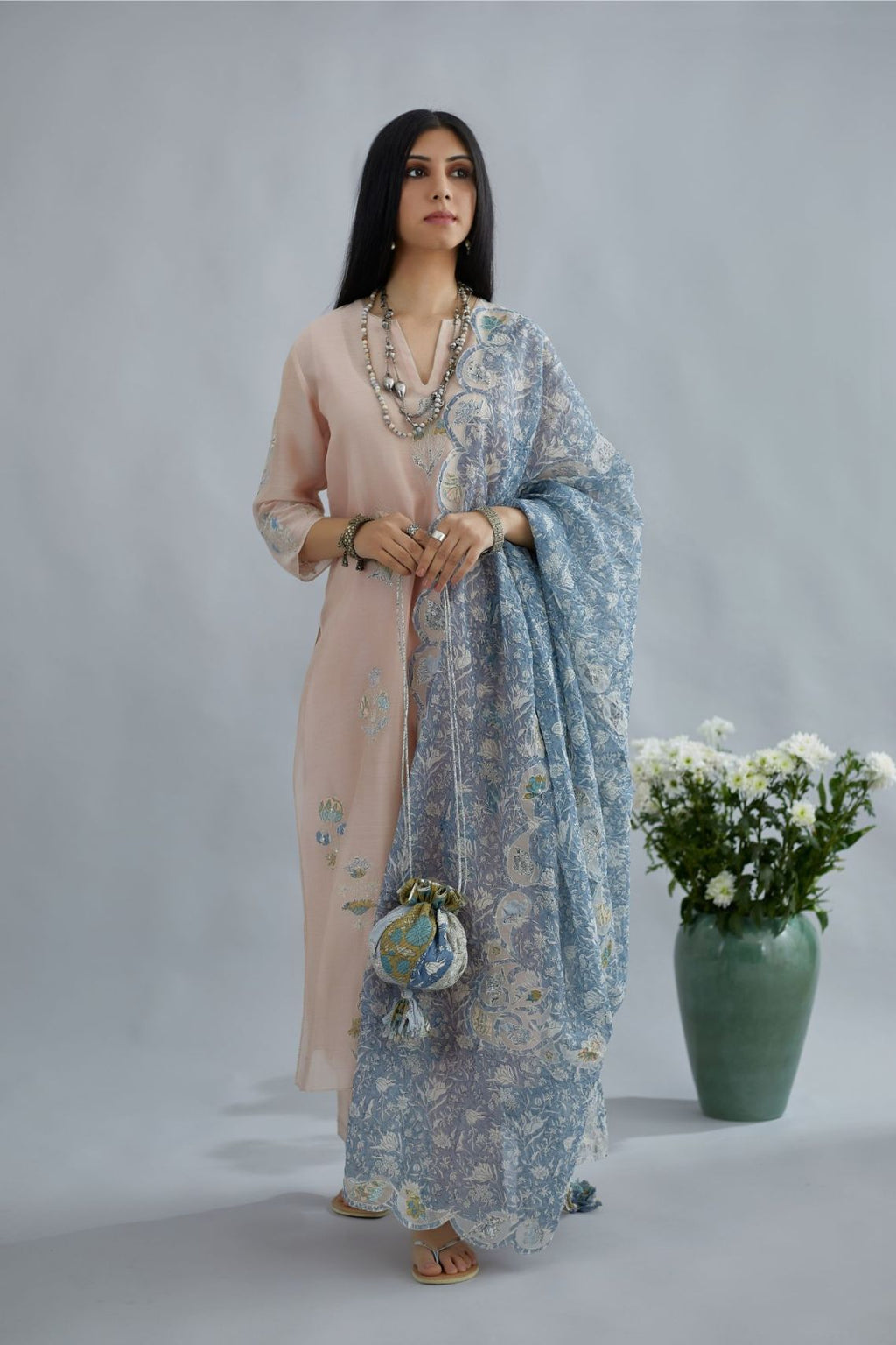 Seashell pink silk Chanderi straight kurta set with all-over floral applique, highlighted with sequin embroidery and silver zari detail.