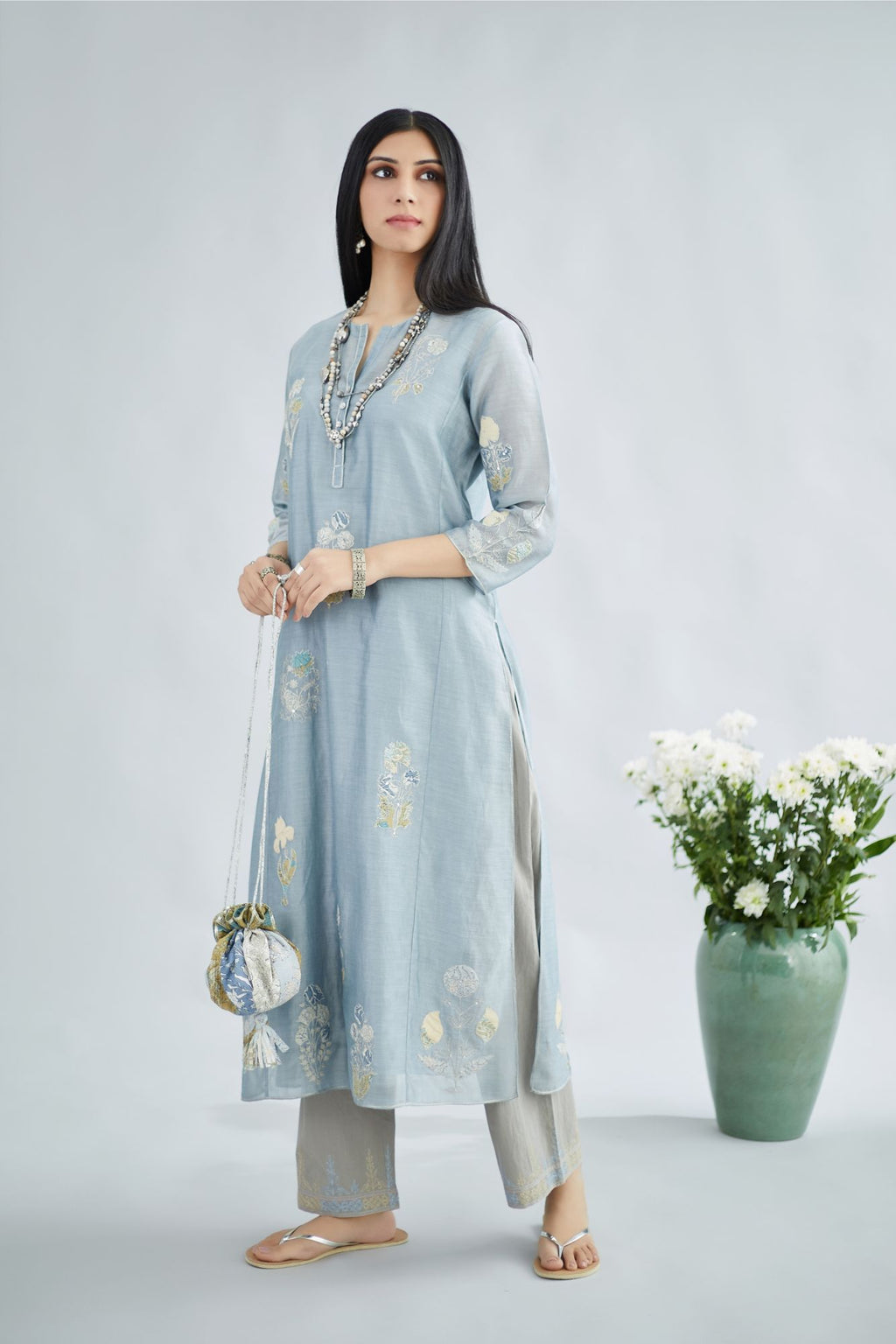 Pigeon blue silk Chanderi straight kurta set with all-over floral assorted print applique, highlighted with sequin and silver zari embroidery.