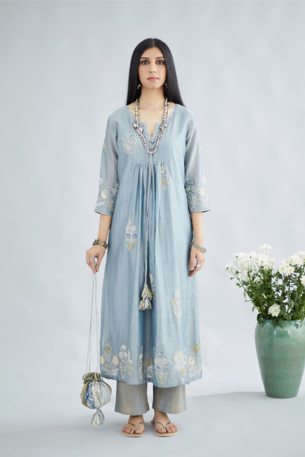 Silk Chanderi kurta set with all-over floral printed applique and fine gathers at waistline and ornamental cords at neckline