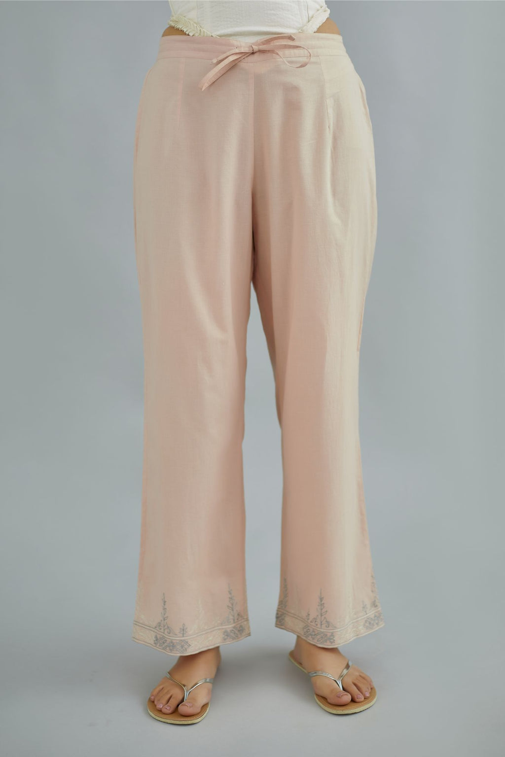 Pink straight cotton pants with thread embroidery at bottom hem