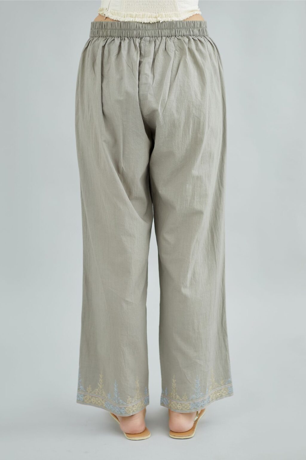 Cool grey straight cotton pants with thread embroidery at bottom hem